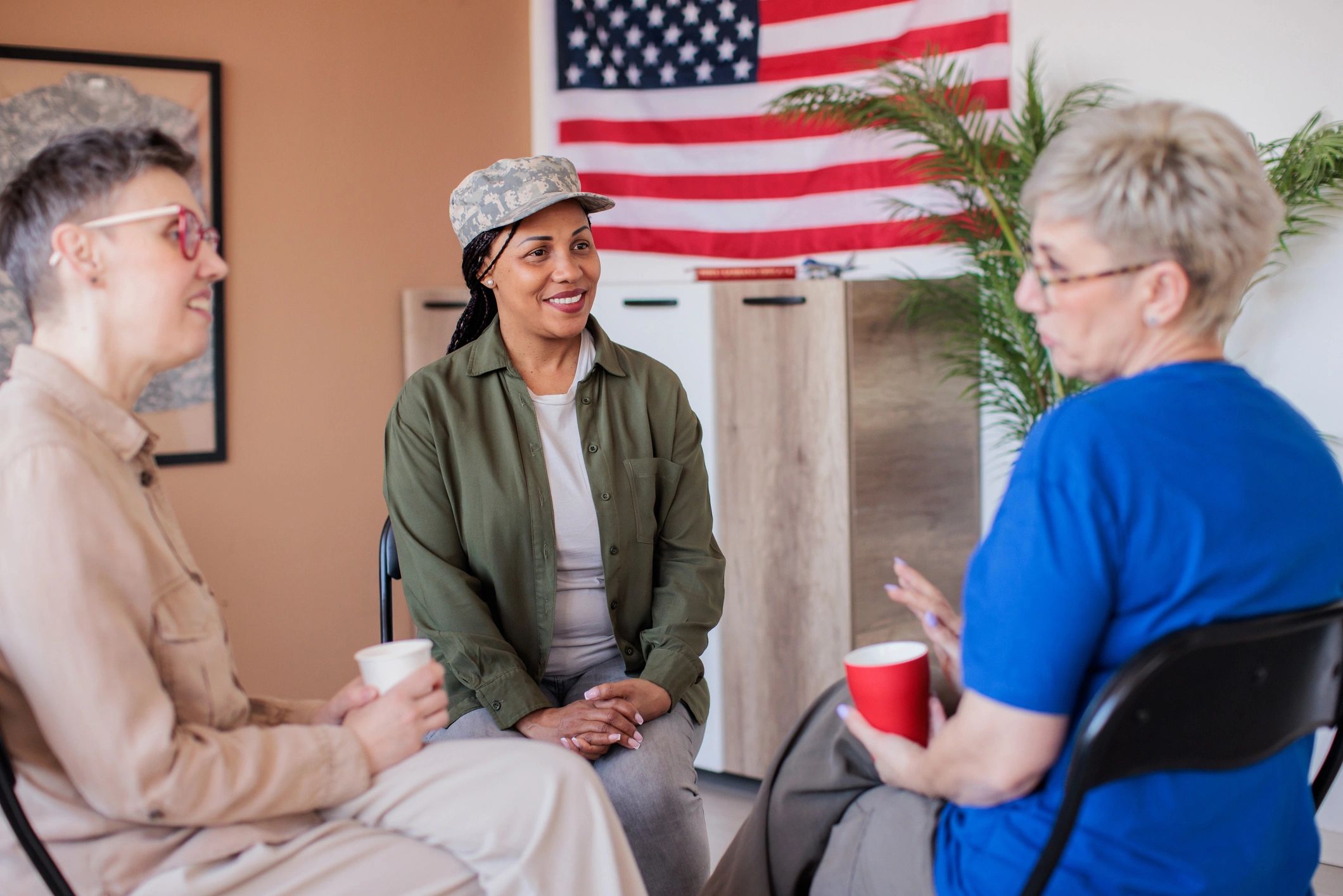 Veteran speaking with peers in a support meeting