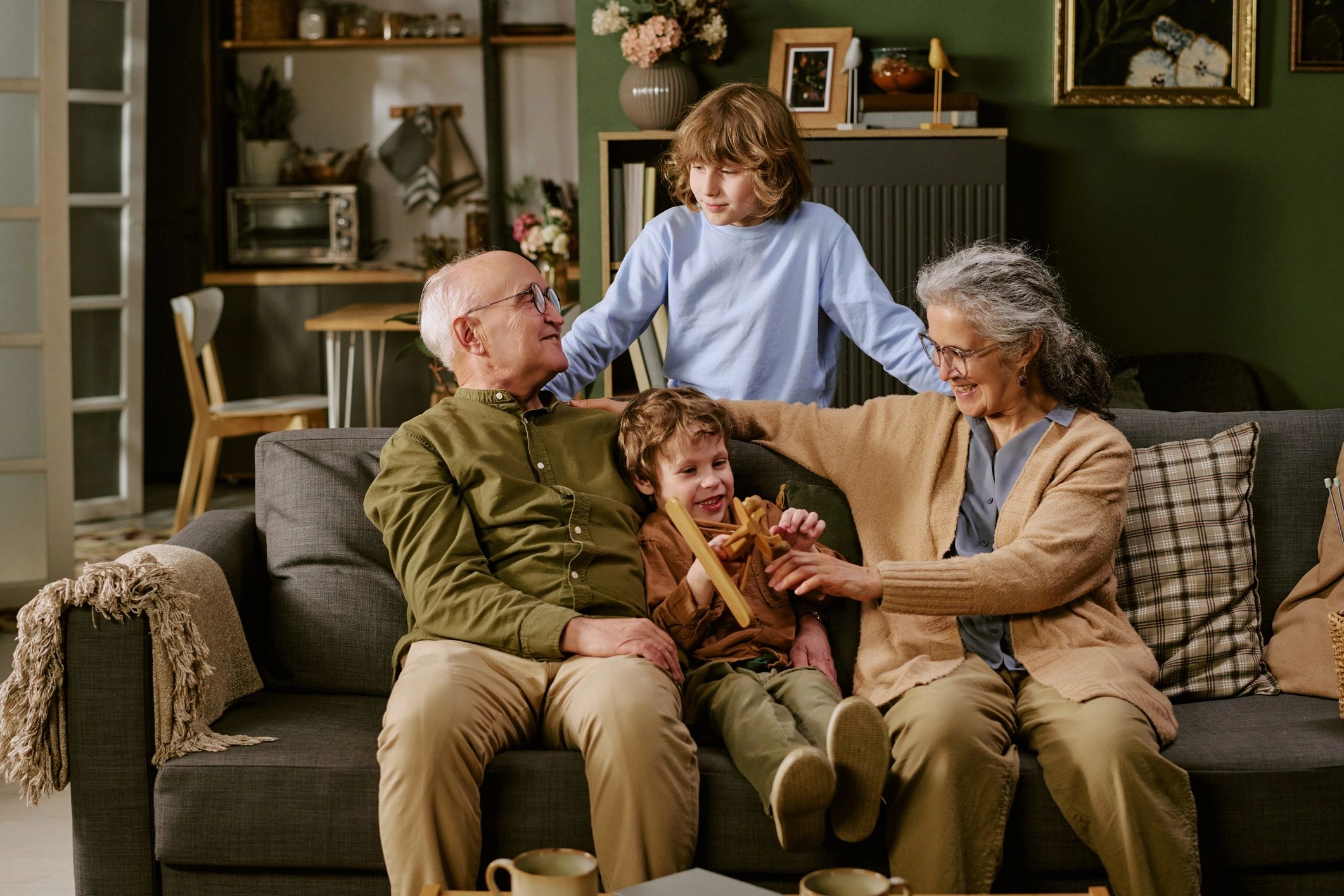 Grandparents spending time with grandchildren at home